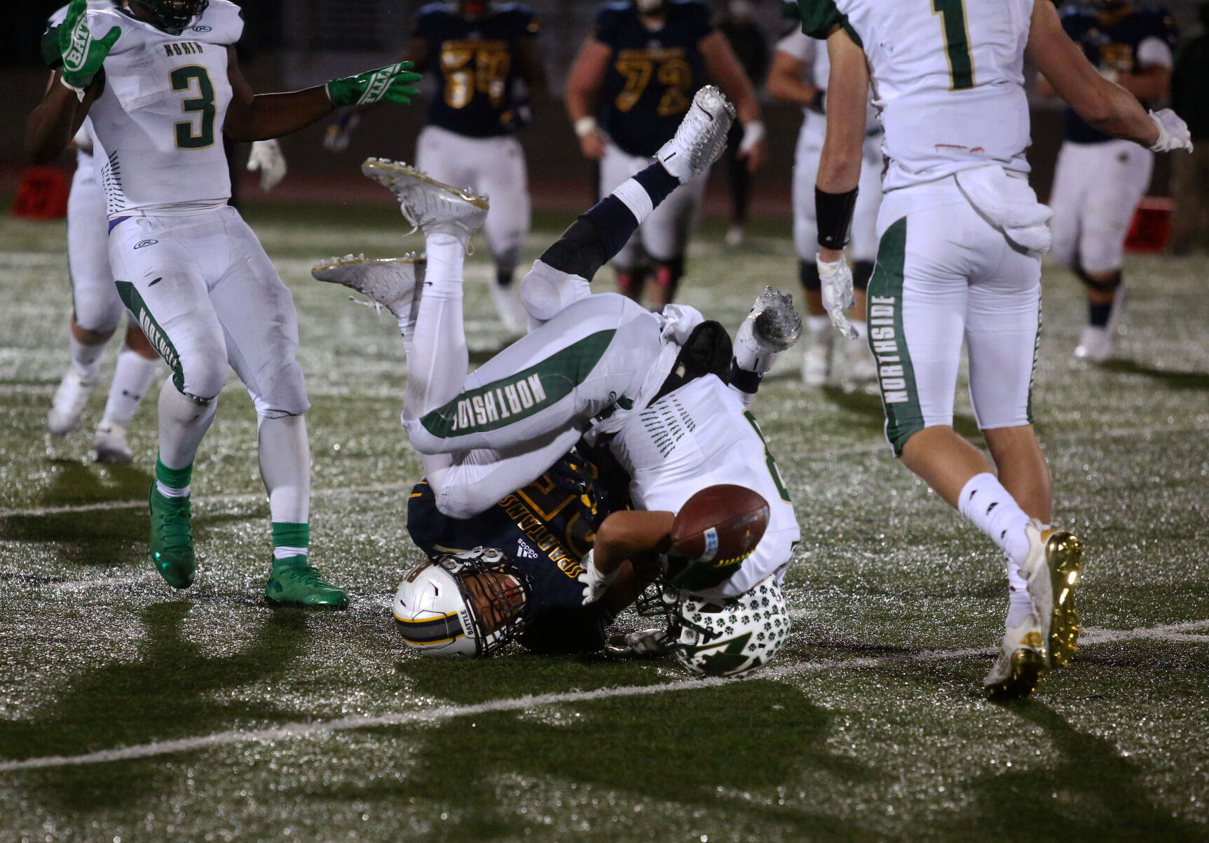 Fort Zumwalt North junior Chris Reckel tackles Battle sophomore Tyson Ellison